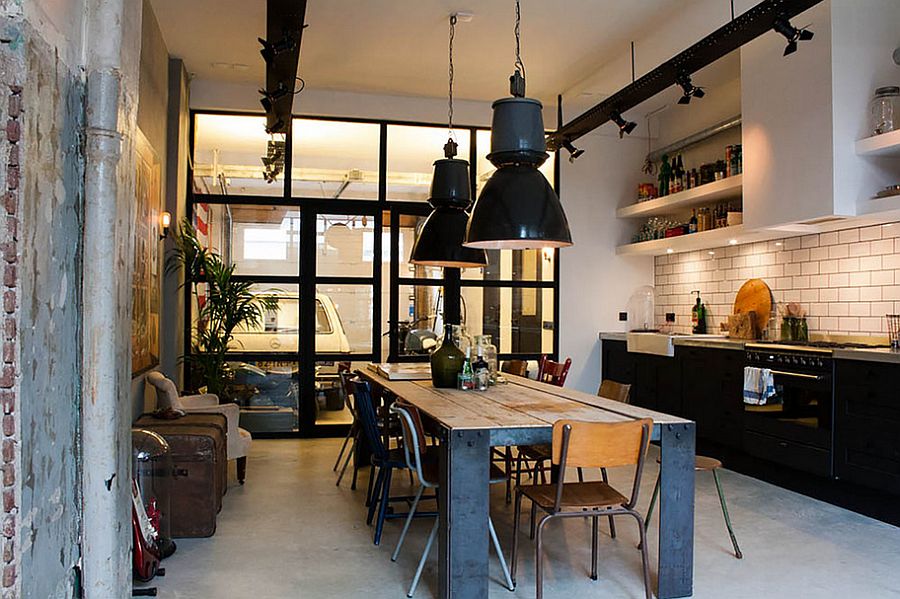 Simple and spacious industrial kitchen design with black pendants that stand out visually [Design: Bricks Amsterdam / Photo: Louise de Miranda]