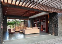 Stone-walls-shape-the-open-living-room-of-the-Bali-home-217x155