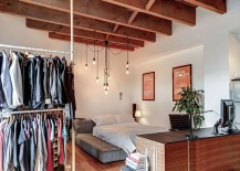 Stylish-pendant-lighting-in-this-loft-bedroom-saves-up-on-space-217x155