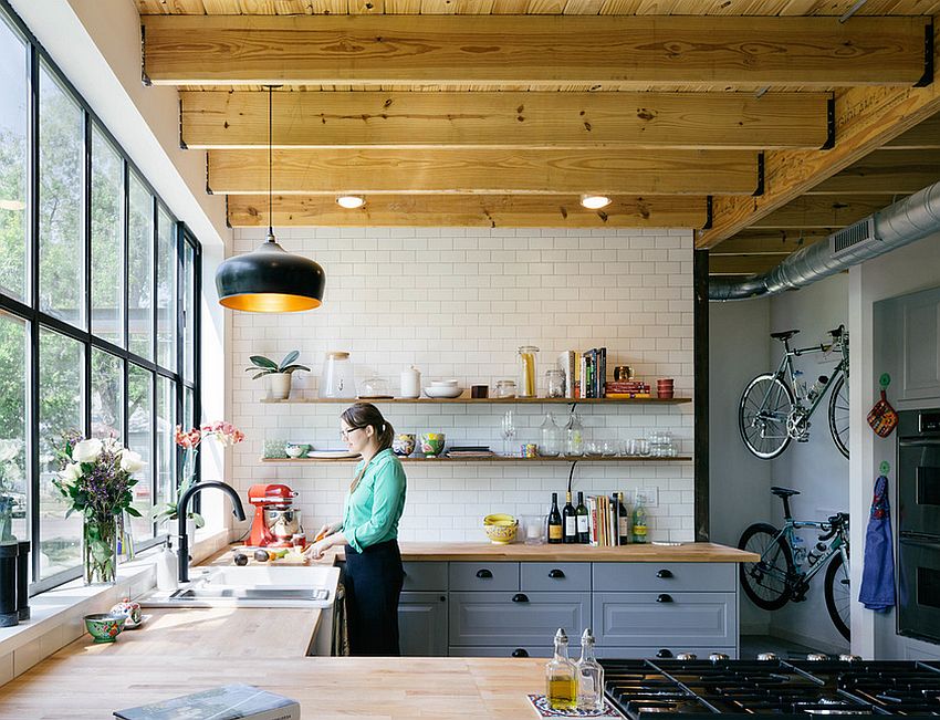 Tile and wood meet inside this lovely industrial kitchen