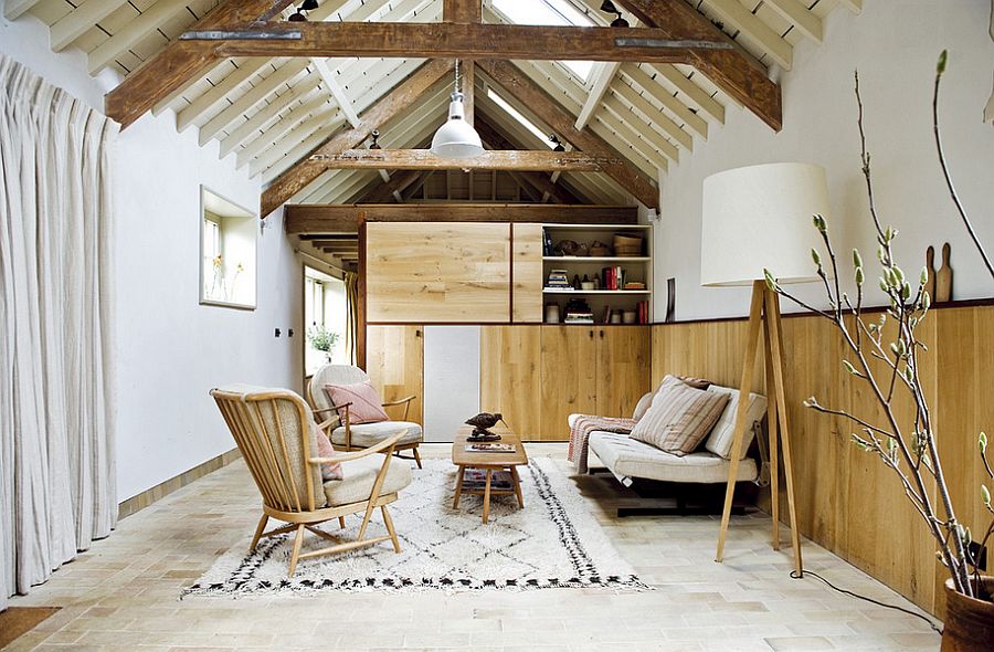 Tranquil living room with warm reclaimed wood wall [Design: Retrouvius Ryland Peters & Small]