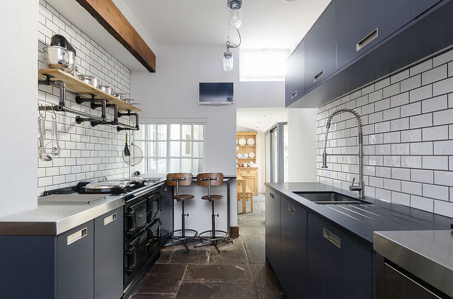 Trendy gray cabinets inside the narrow kitchen [Design: Moon Design + Build]