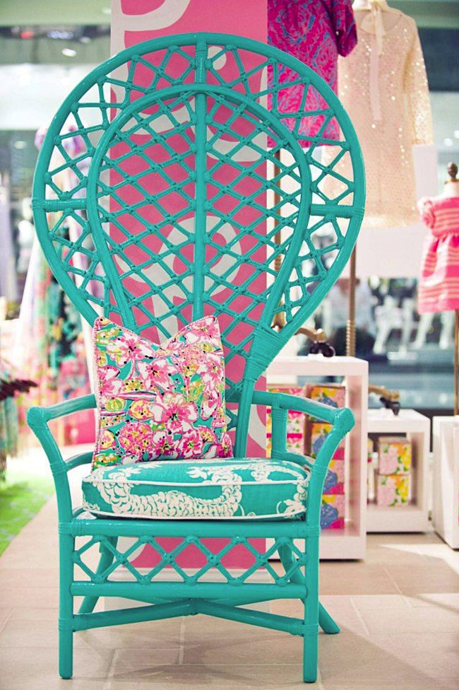 Turquoise peacock chair with vibrant cushions