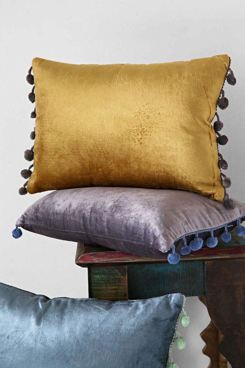 Velvet pom pom pillows from Urban Outfitters