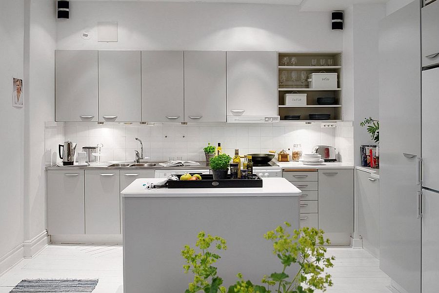 White subway tiles create a cool backsplash in the kitchen