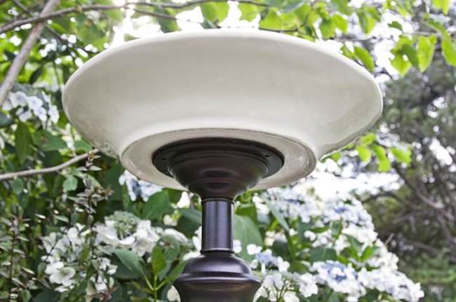 Large bowl glued to the top of an old lamp