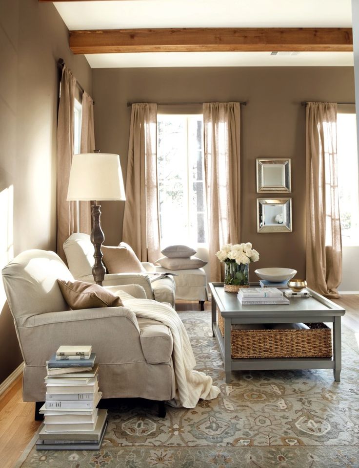 Burlap curtains blend in with the homey decor of this living room