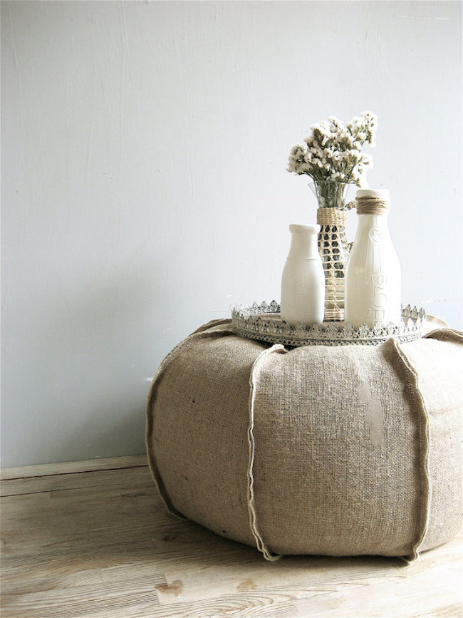 Burlap ottoman can also be used as a smart bedside addition!