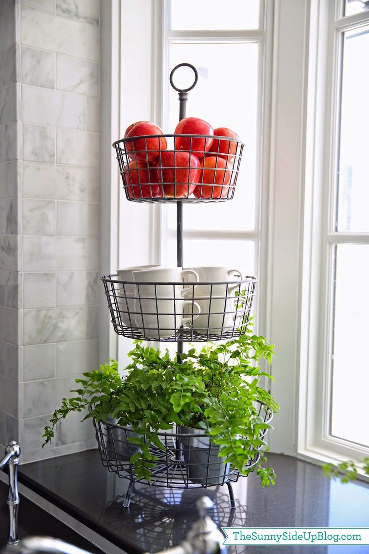 Elegant fruit stand looks good on the kitchen island as well