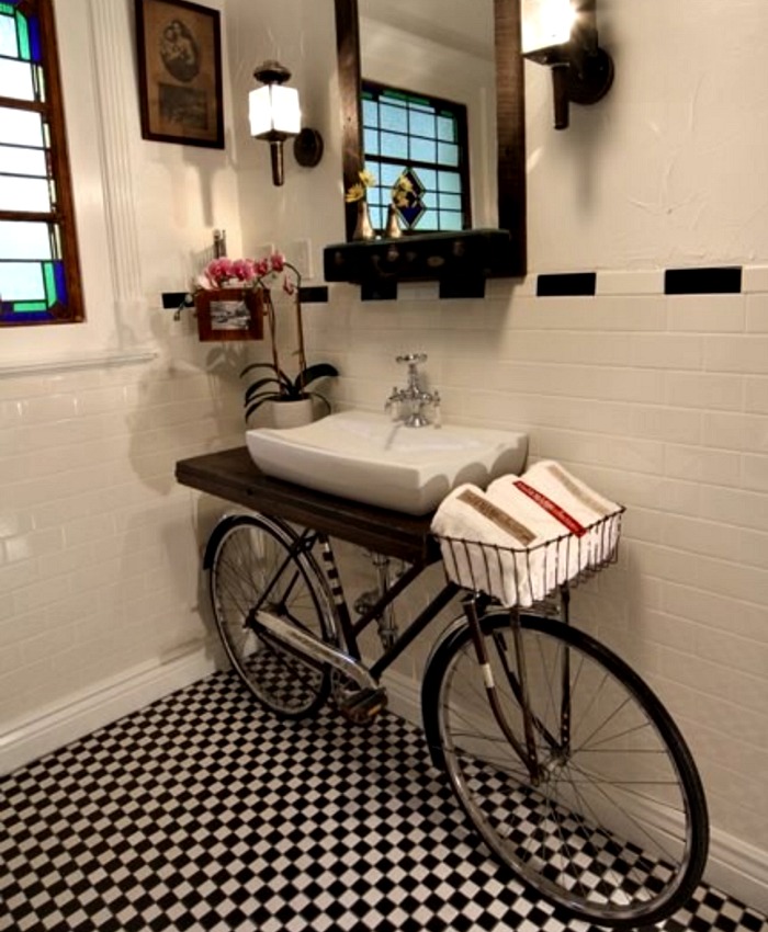 Old bike turned into a striking bathroom vanity for the black and white bathroom