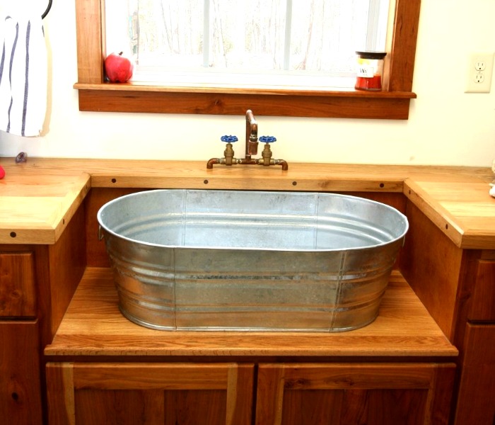 Galvanized tub used to shape a custom bathroom vanity