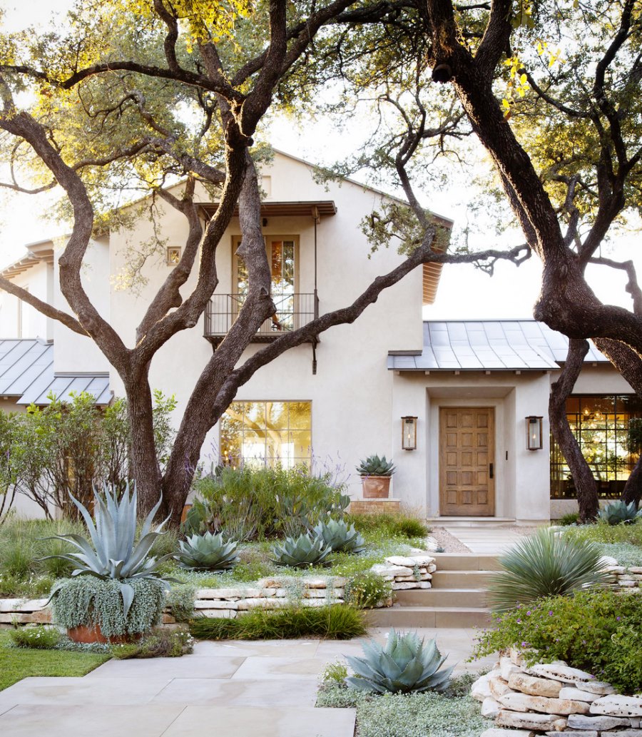 Beautiful stucco home with native landscaping