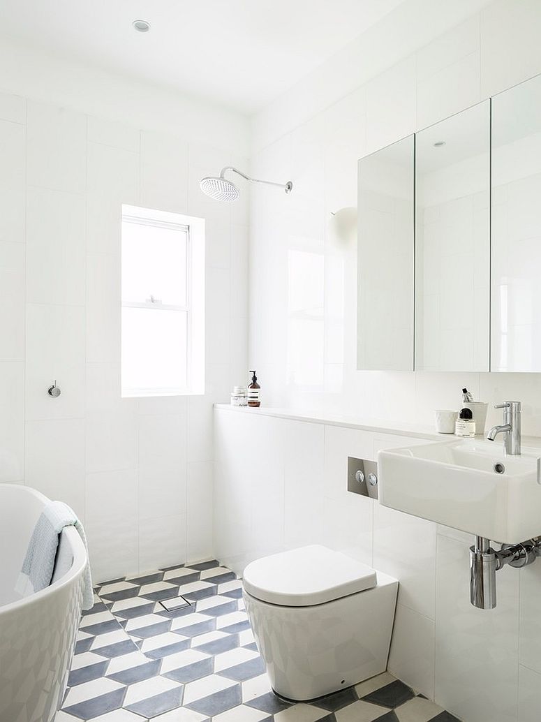 Black and white geometric floor tile for the beach style bathroom [Design: Decus Interiors]