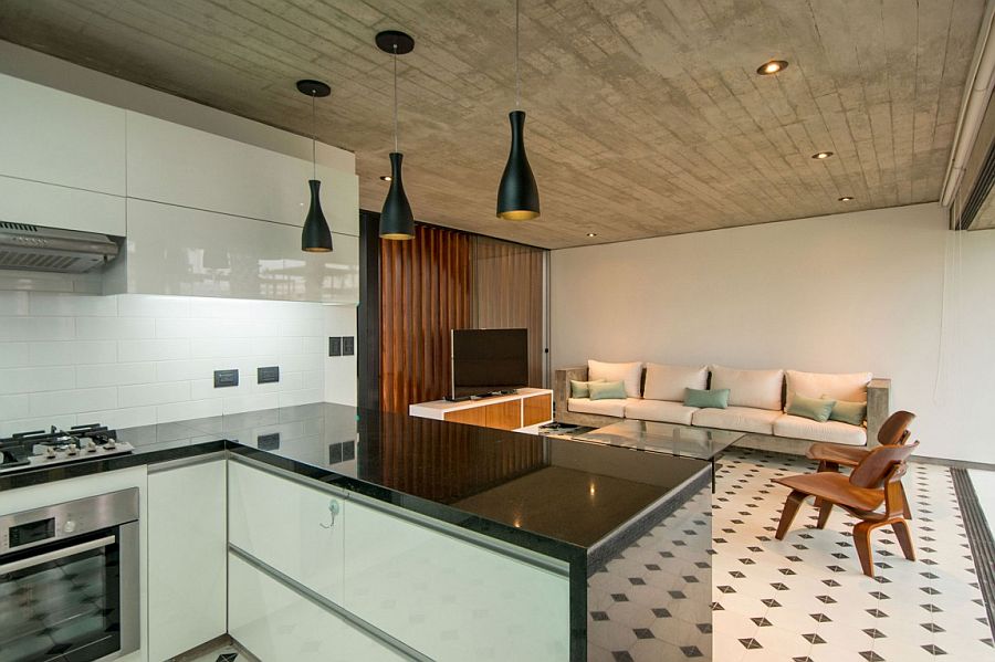 Black pendant light above the kitchen counter