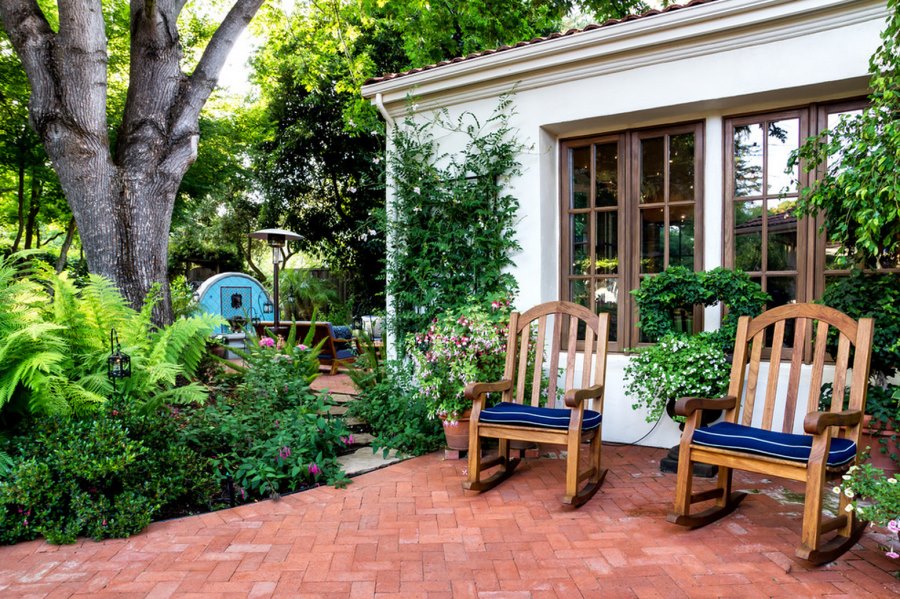 Brick herringbone patio with rocking chairs