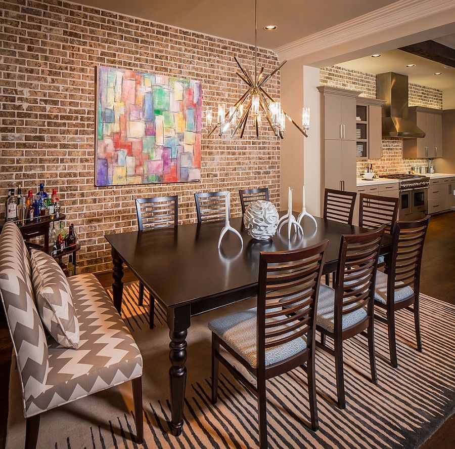 Brick wall offers a lovely backdrop for the colorful wall art piece [Design: Jamestown Estate Homes]
