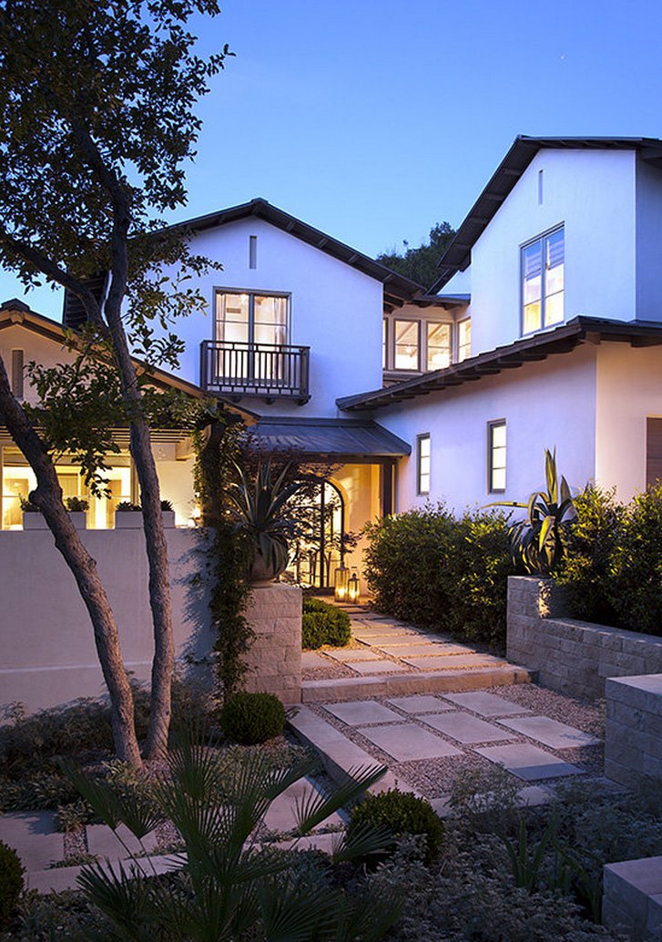 Classic stucco home with a modern walkway