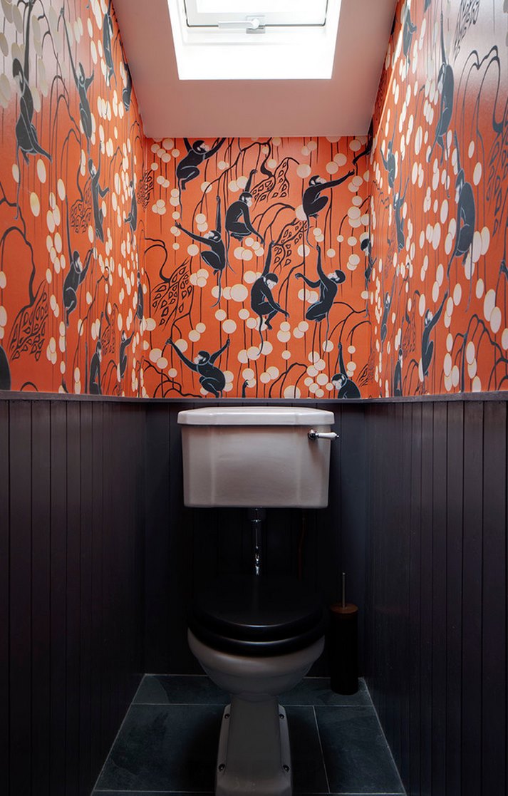 Colorful wallpaper in a bathroom with beadboad paneling