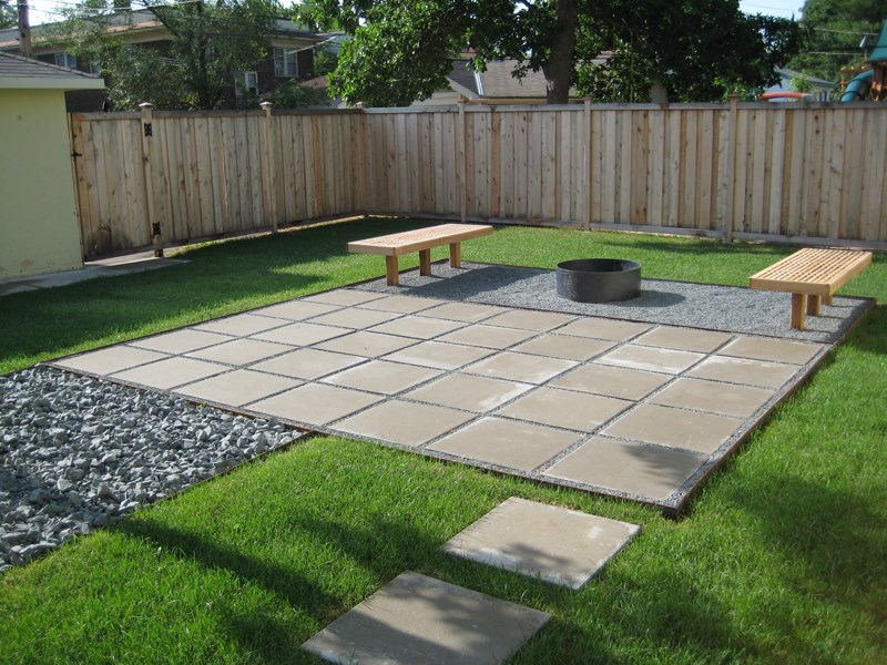 Contemporary paver patio in a clean lined yard