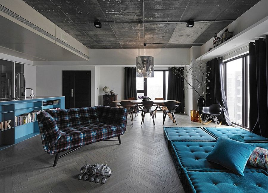 Dark open plan living area with dining room and kitchen