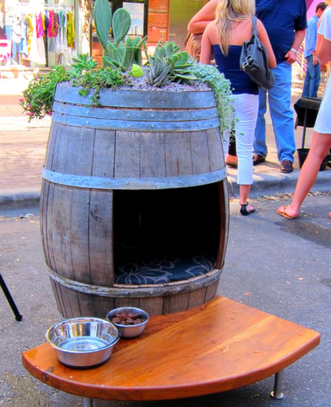 Old wine barrel turned into a doghouse