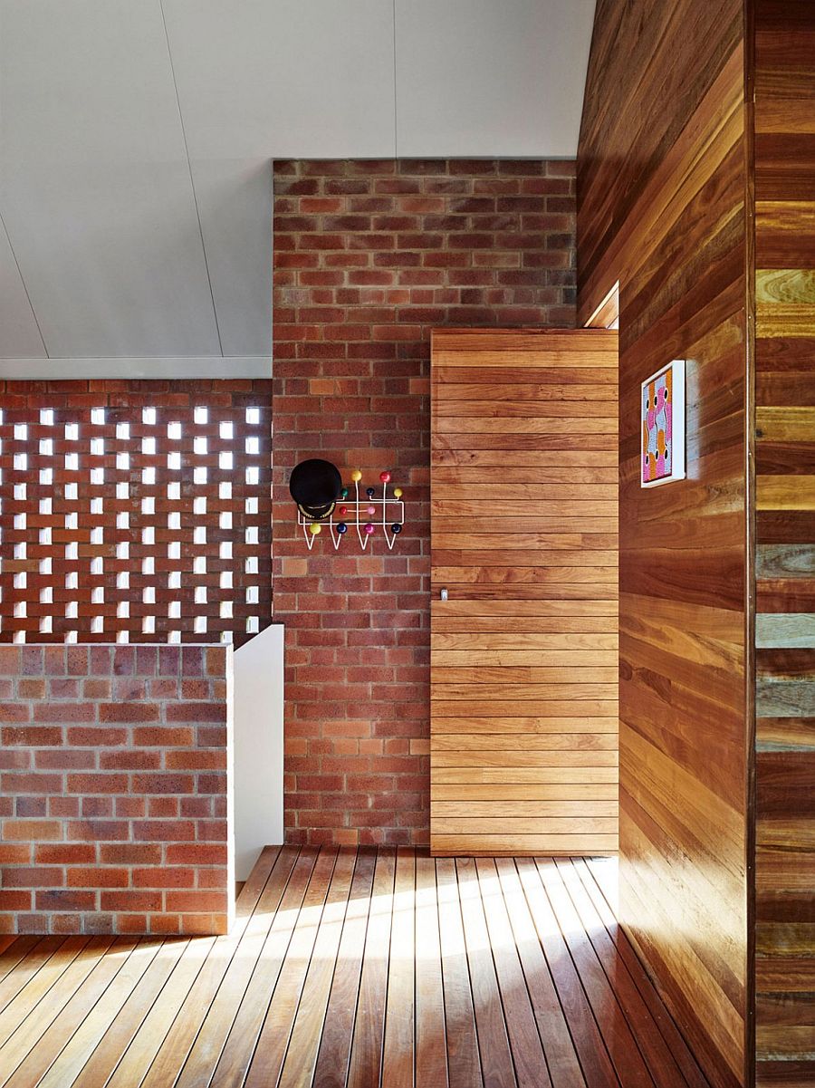 Eames coat hanger adds a touch of Midcentury beauty to the brick and timber home