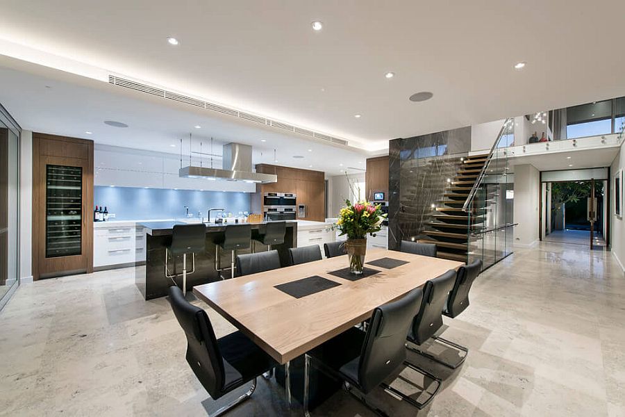 Formal dining space with wooden table and dark chairs