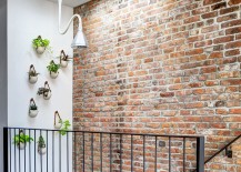 Gorgeous-wall-planters-next-to-the-staircase-with-skylight-above-217x155