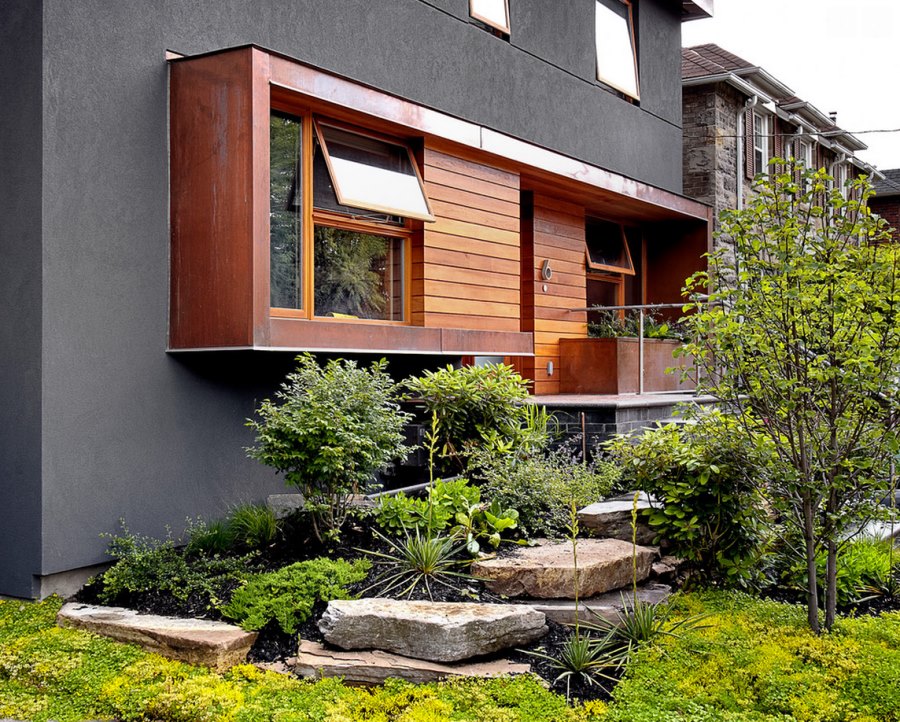 Grey stucco home with modern landscaping