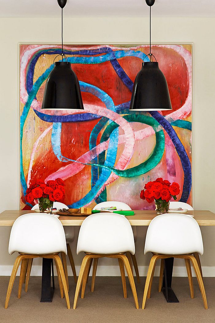 It is the art piece that sets the mood in this dining room