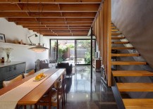 Lower-level-sitting-area-alongw-ith-kitchen-and-dining-217x155
