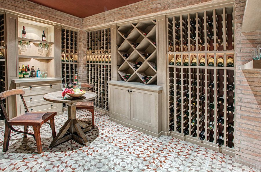 Mediterranean style wine cellar with beautiful lighting and floor [Design: Meridith Baer Home]