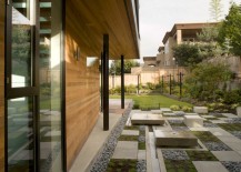 Modern-yard-with-squares-of-concrete-gravel-and-plants-217x155