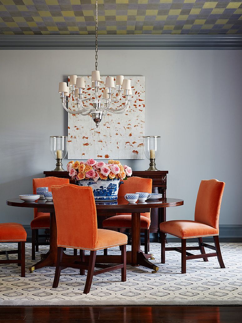 Orange chairs seem perfectly at home in this beach style dining room