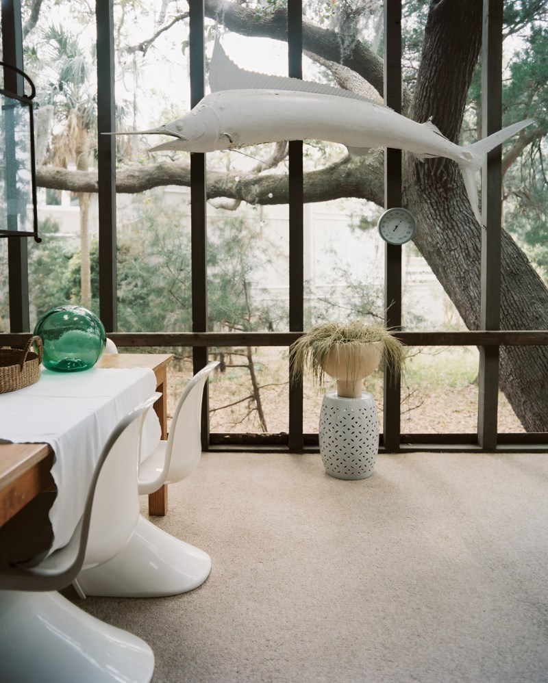 Quirky decor in a screened-in porch