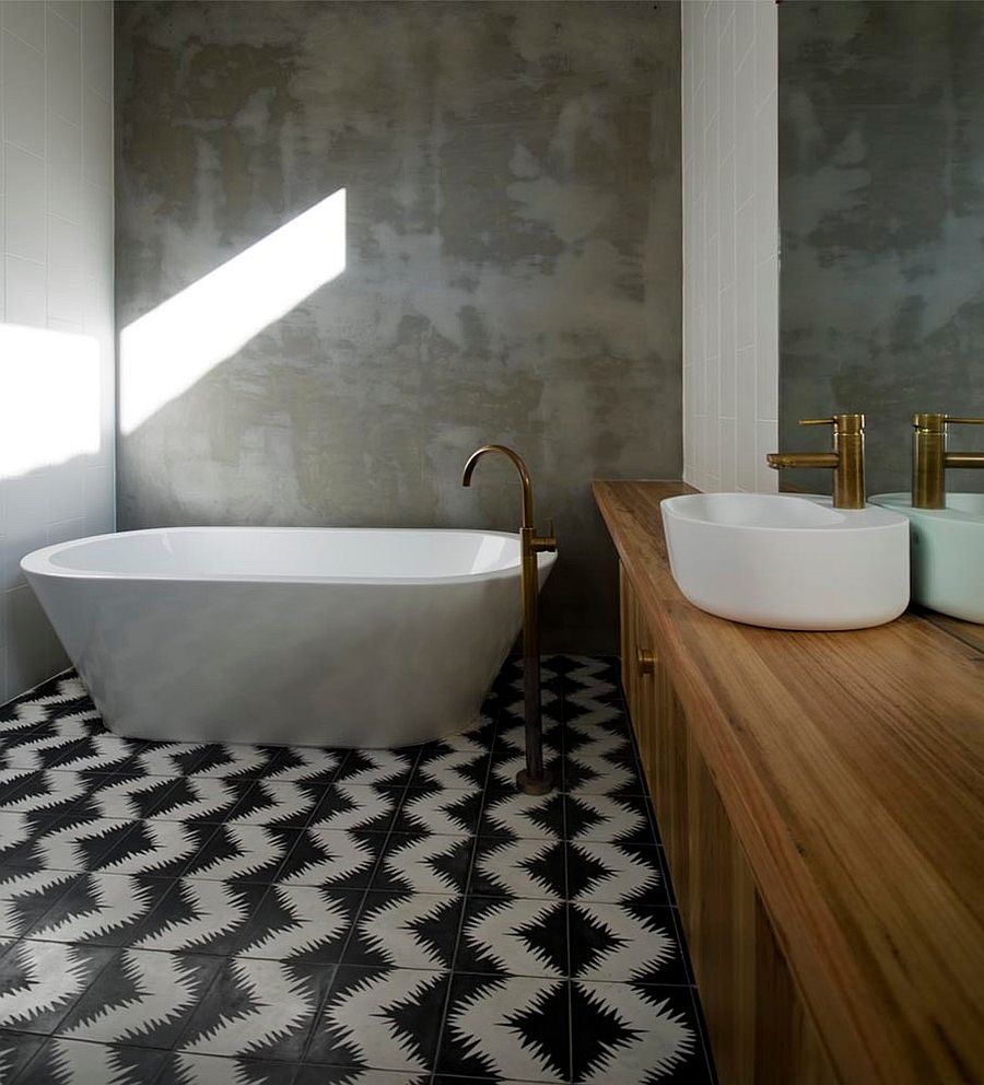 Rendered concrete walls of the bathroom stand in contrast to the geometric cement tiles [Design: Auhaus Architecture]