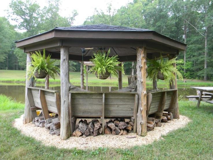 Rustic gazebo with potted ferns