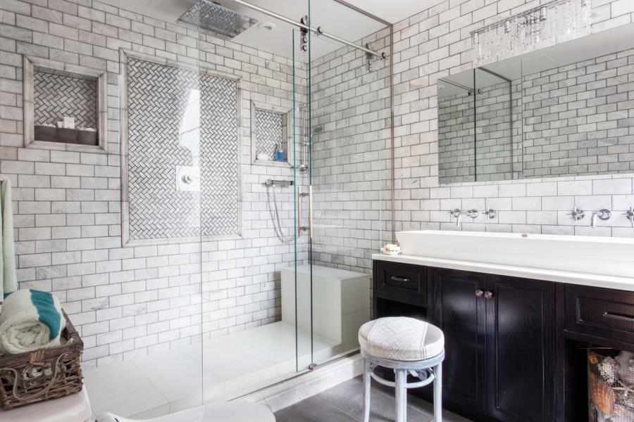 Shower with subway tile and glass doors