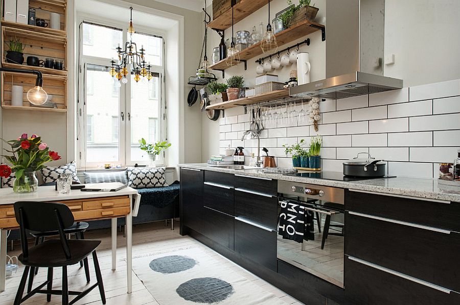 Small and stylish Scandinavian kitchen design with breakfast nook and floating wooden shelves [Design: Studio Cuvier]