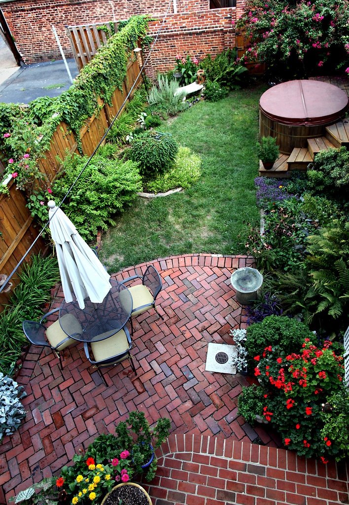 Small backyard with a brick patio