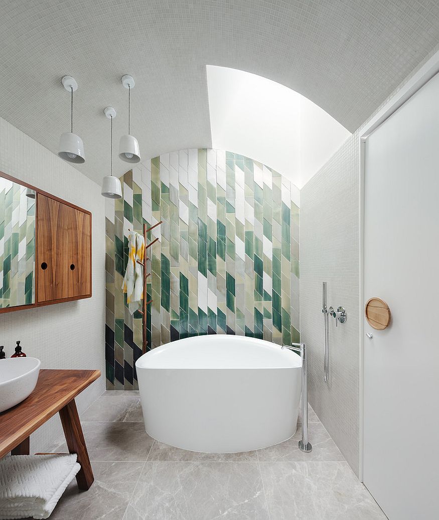 Snazzy green tiles used to create an awesome feature wall in the bathroom [Design: Day Bukh Architects]