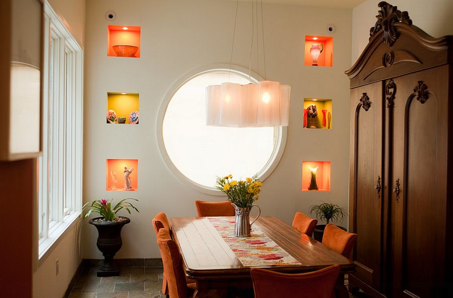 Subtle use of yellow and orange pops in the dining room [Design: Michele Plachter Design]