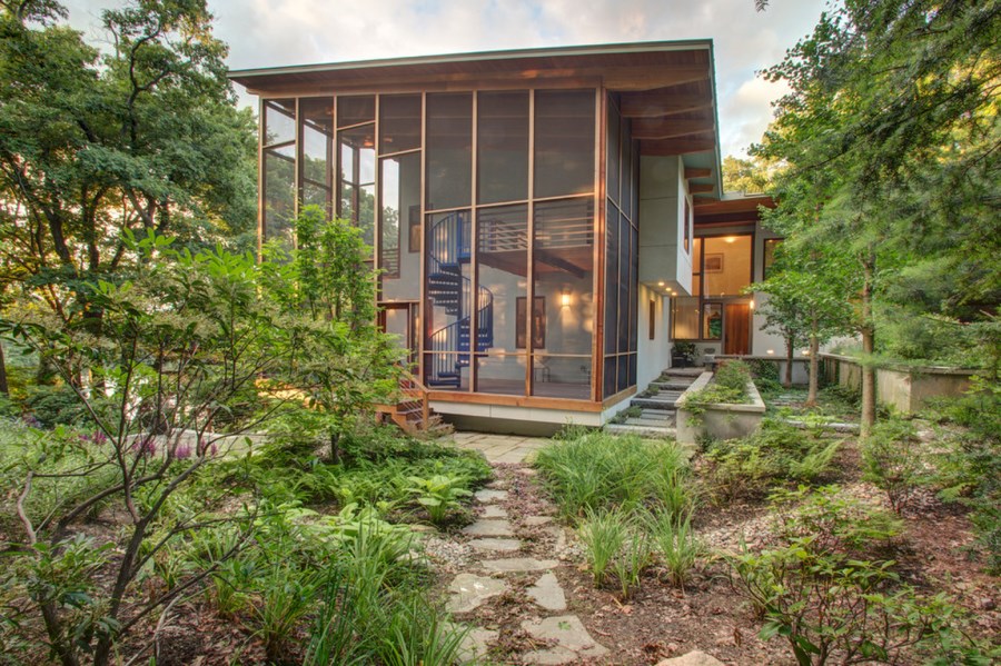 Tall screened-in porch with a spiral staircase