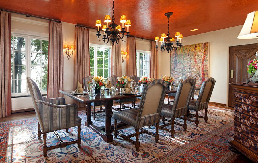 Textured orange ceiling becomes the focal point of this dining room