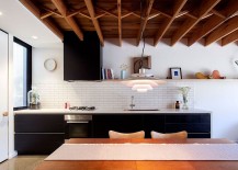 Tiled-kitchen-backsplash-in-white-along-with-black-shelves-217x155