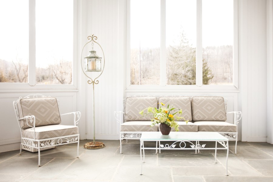 Traditional furniture in a screened-in porch