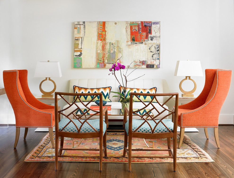 Transitional living room with pops of orange