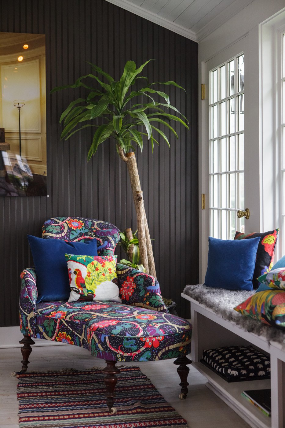 Vibrant patterns in a painted room with beadboard paneling