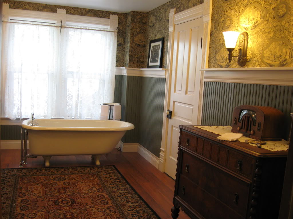 Elegant Victorian beadboard bathroom with warm lighting