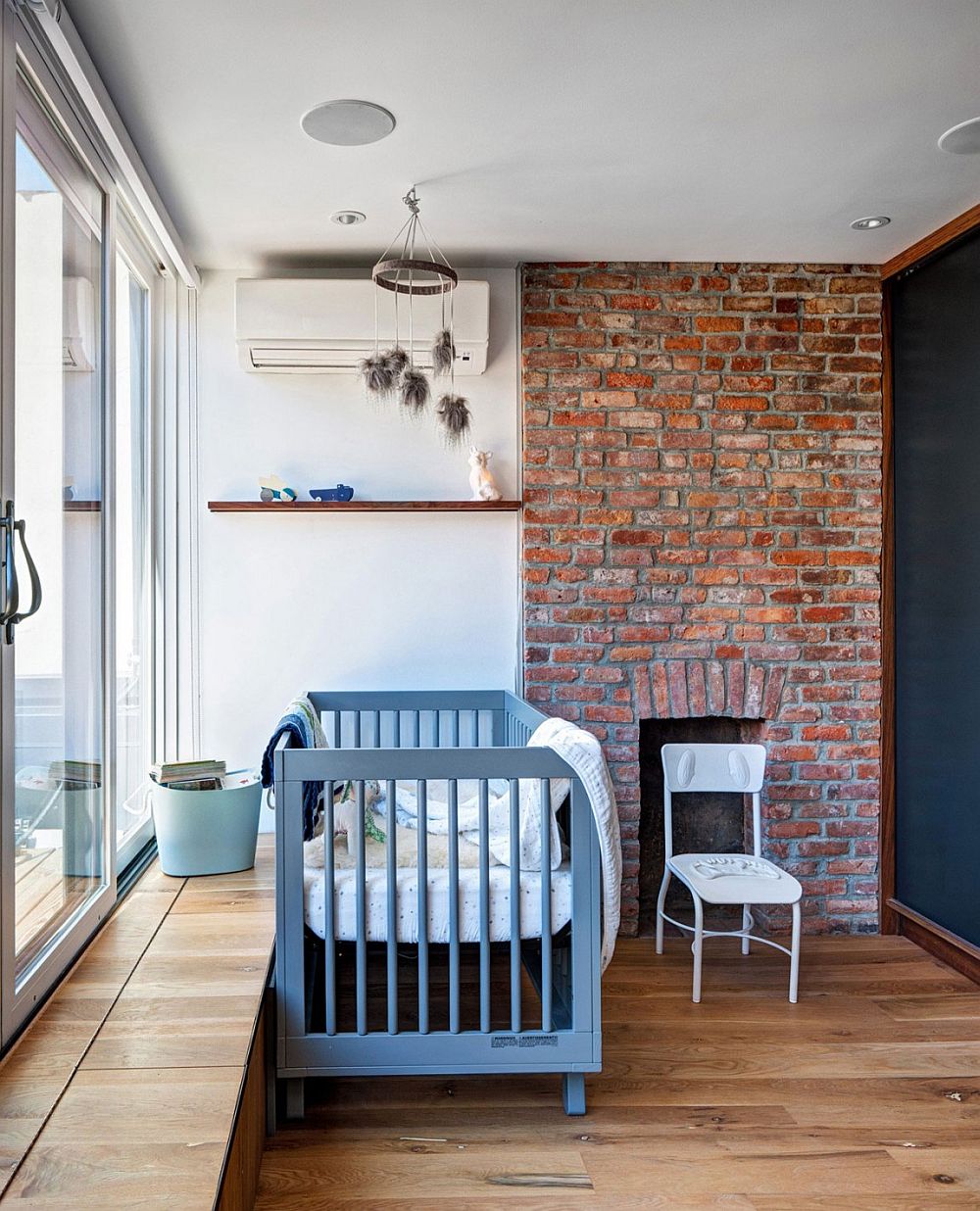 Vintage brick fireplace in the modern nursery